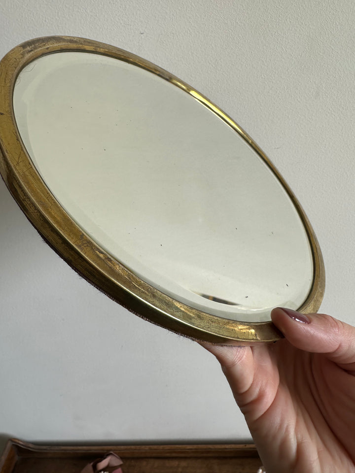 Miroir ovale biseauté à poser armature en laiton