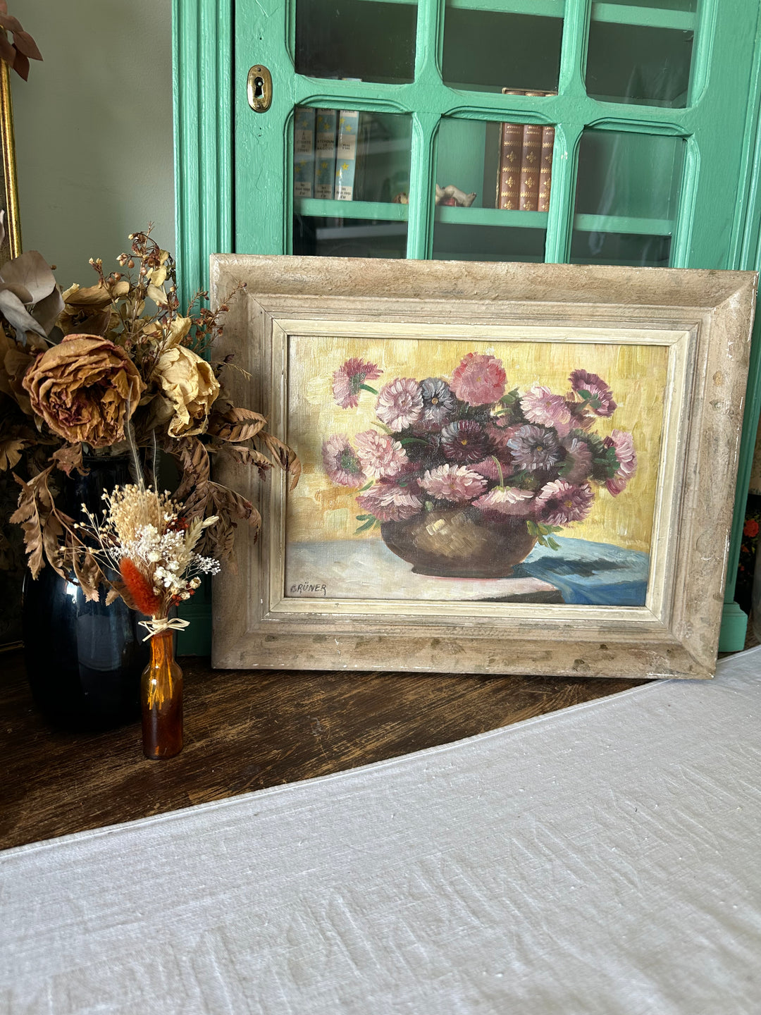 Peinture signée Gruner bouquet de fleurs mauves sur toile