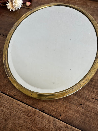 Miroir ovale biseauté à poser armature en laiton