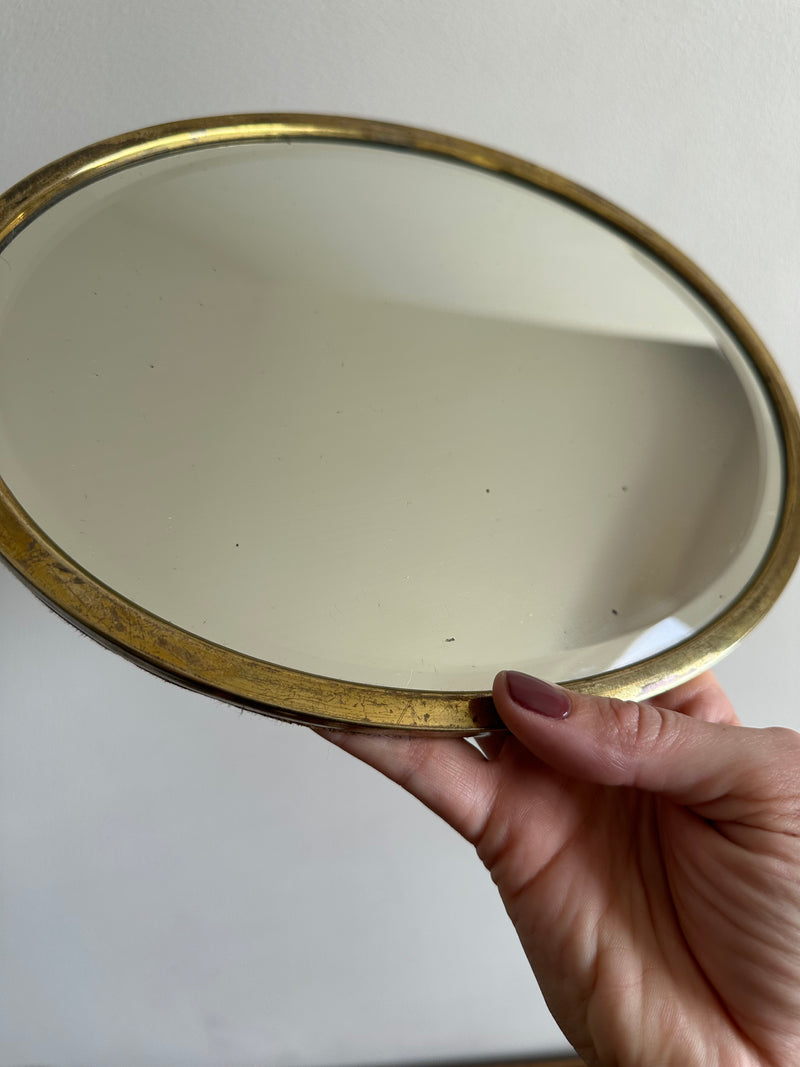 Miroir ovale biseauté à poser armature en laiton