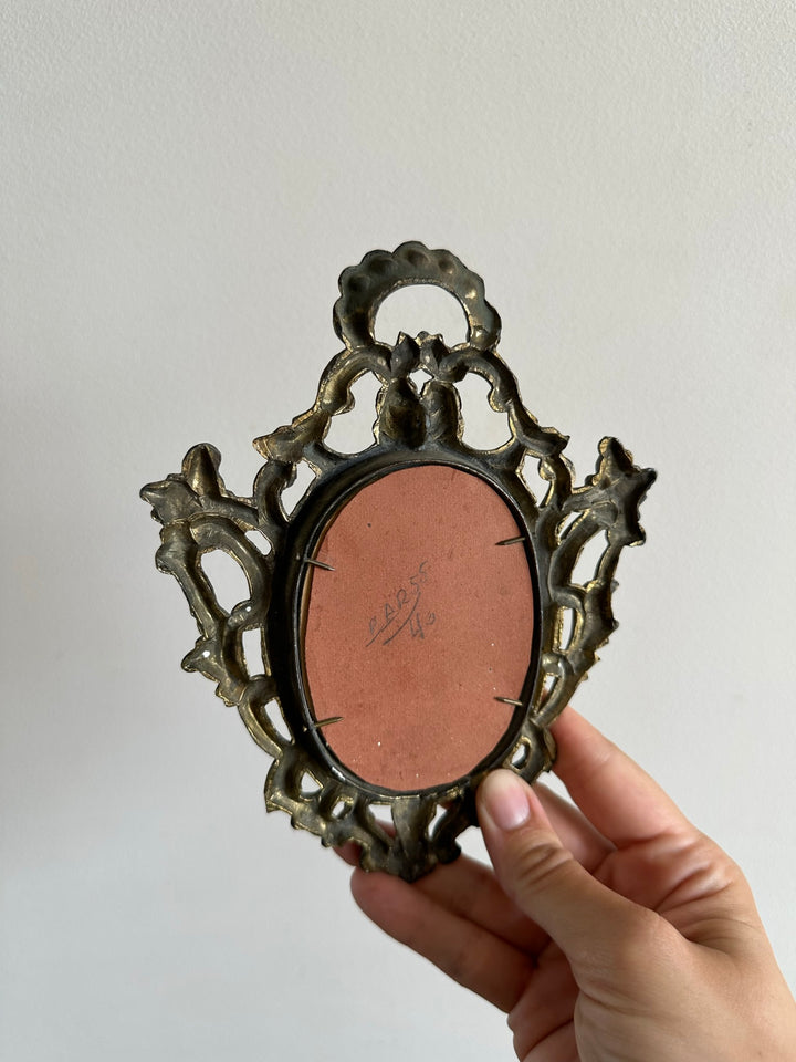 Cadre travaillé baroque en laiton doré