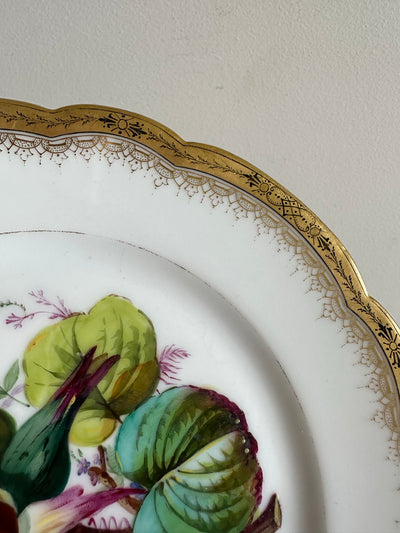 Assiette décorative en porcelaine bordure dorée