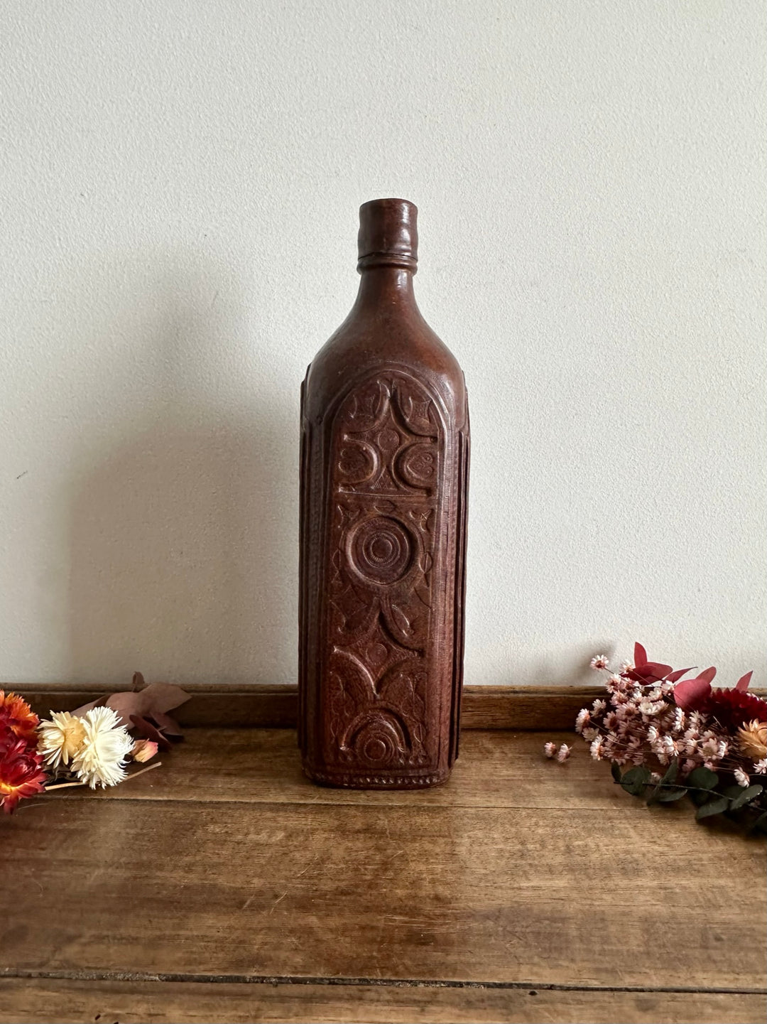 Bouteille recouverte de cuire
