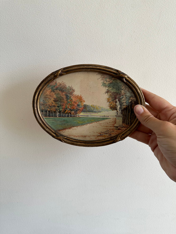 Peinture signée représentant le parc de versailles années 20