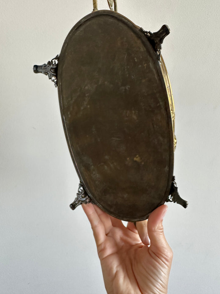 Jardinière en cuivre et laiton gravée sur pieds sculptés