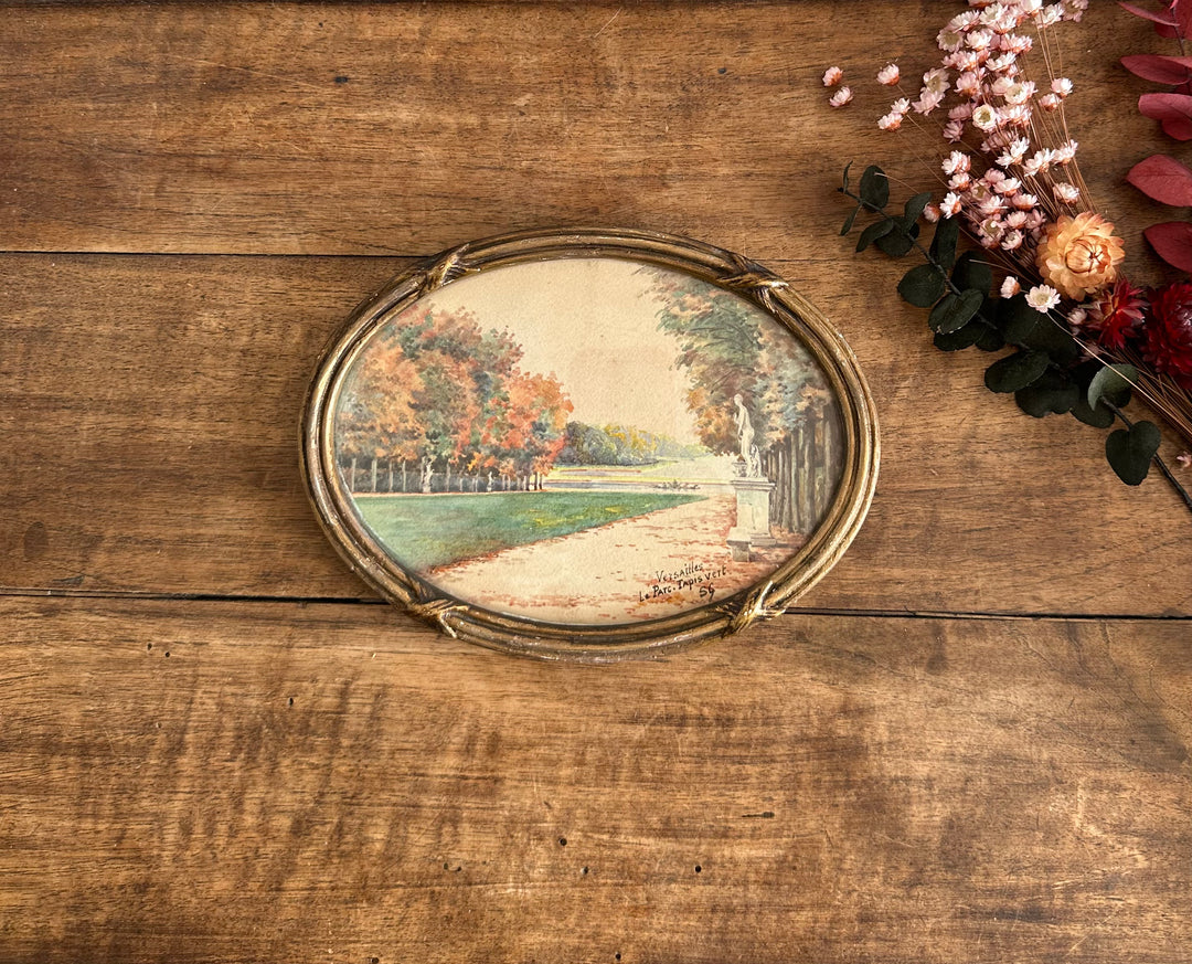 Peinture signée représentant le parc de versailles années 20