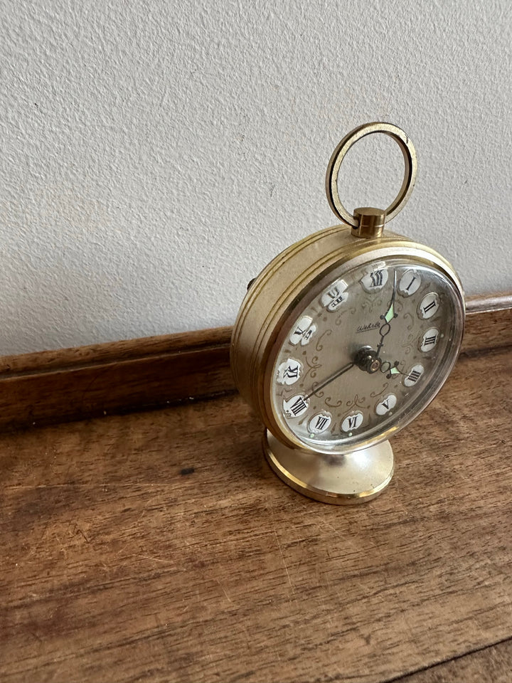 Réveil matin rond sur pied avec anse