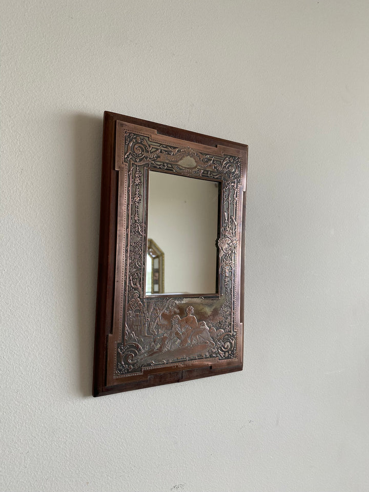 Miroir encadré bois décoré d'une plaque de cuivre
