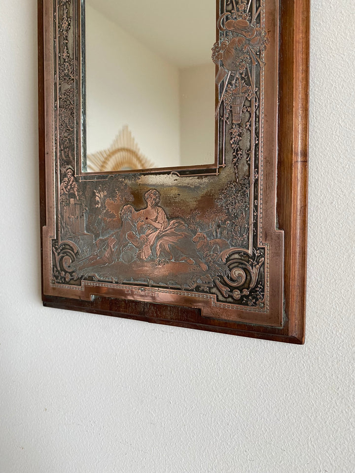 Miroir encadré bois décoré d'une plaque de cuivre