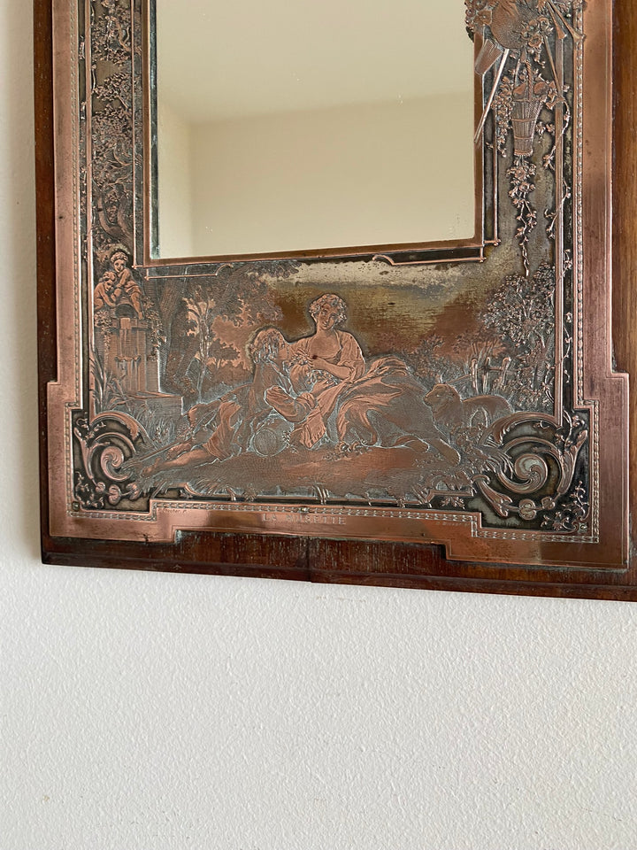 Miroir encadré bois décoré d'une plaque de cuivre