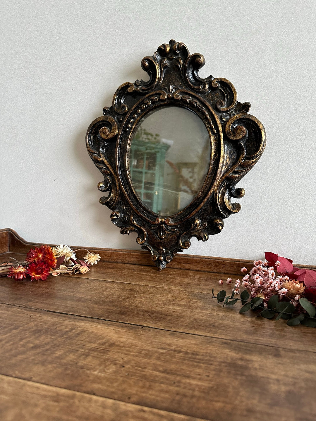 Miroir florentin en bois couleur noir et or