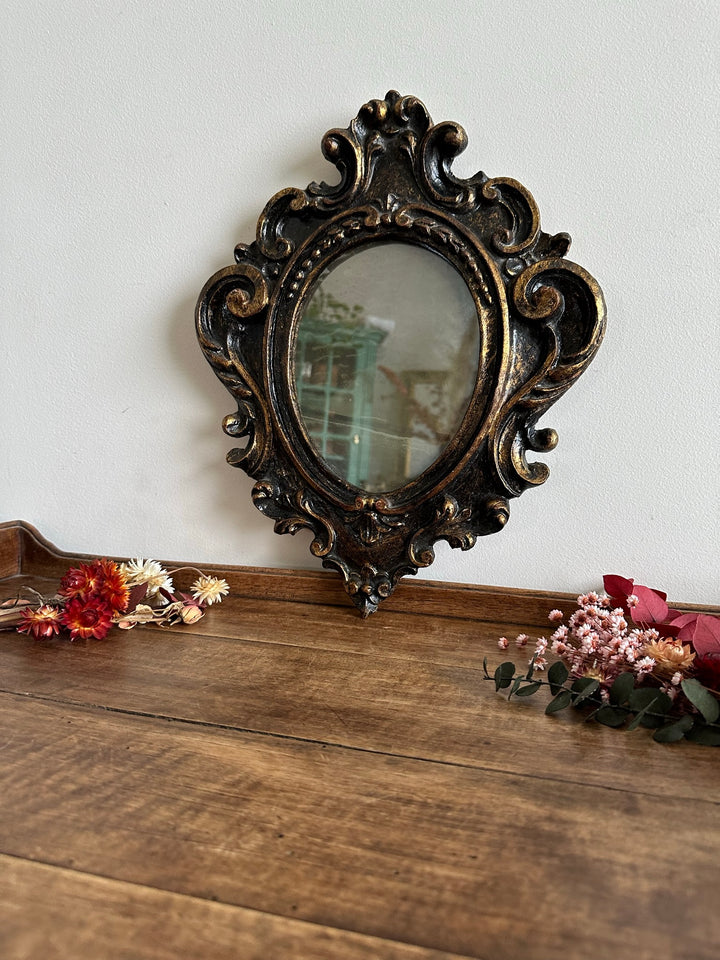 Miroir florentin en bois couleur noir et or