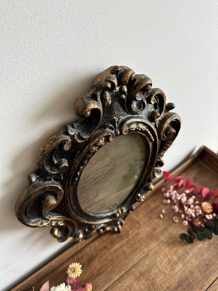 Miroir florentin en bois couleur noir et or