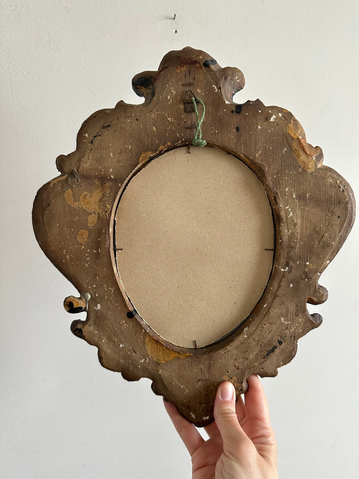 Miroir florentin en bois couleur noir et or