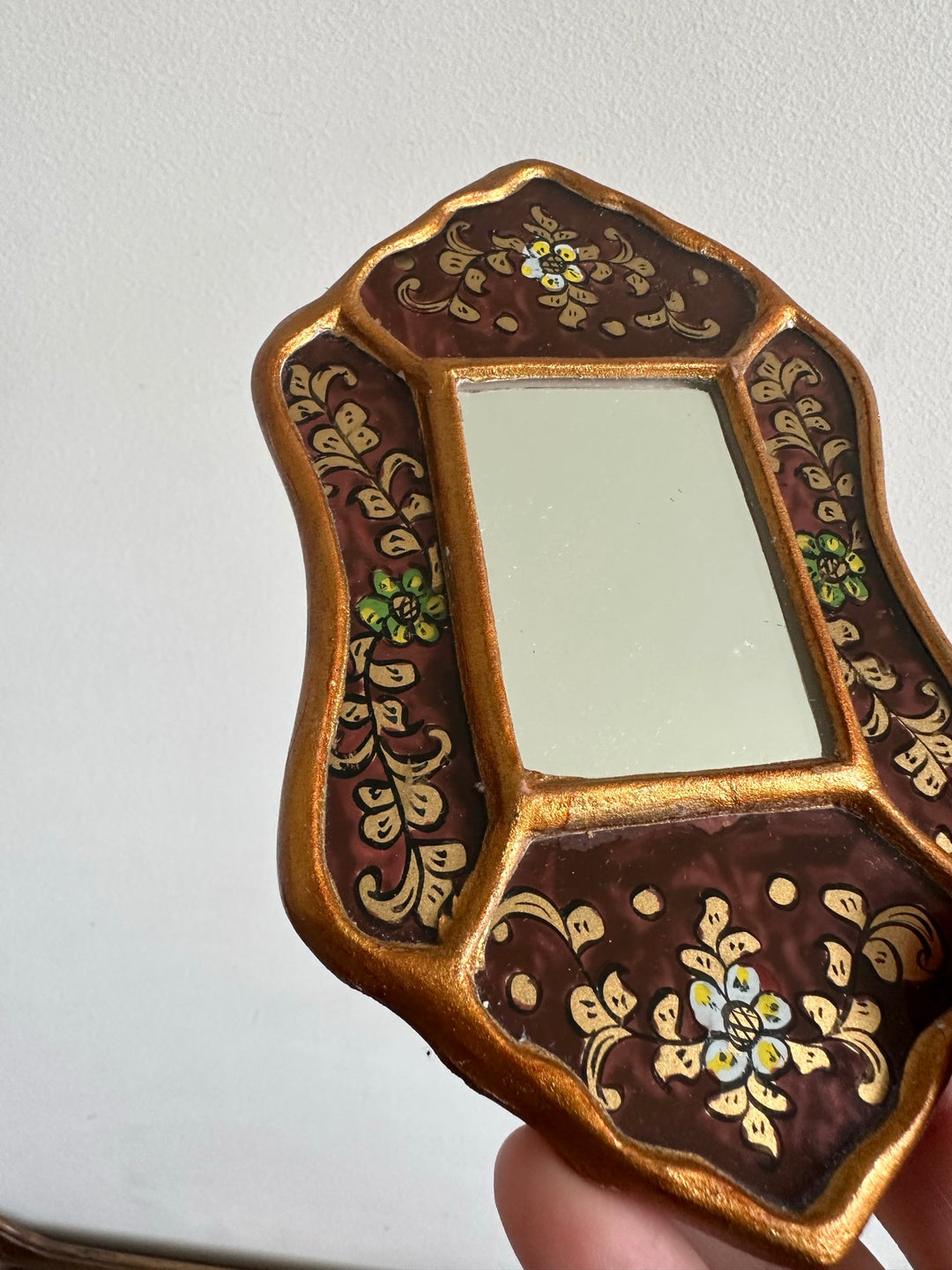 Miroir péruvien émaillé or et marron glacé