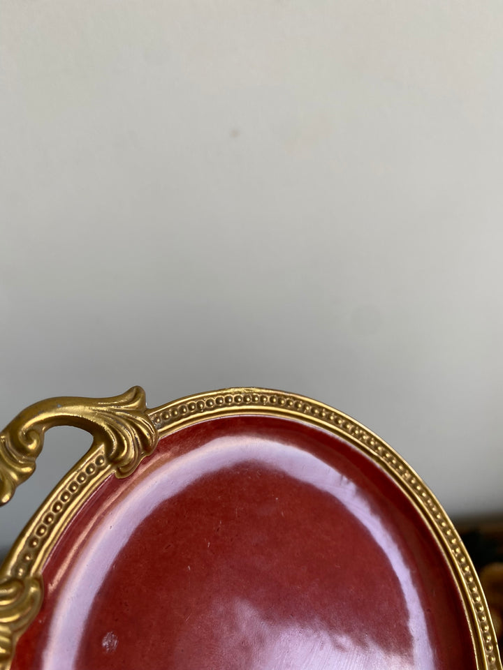 Coupelle en porcelaine rouge anse dorée