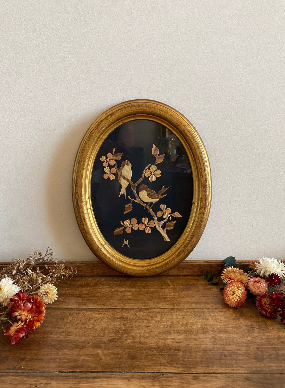 Cadre en bois doré avec motifs oiseaux