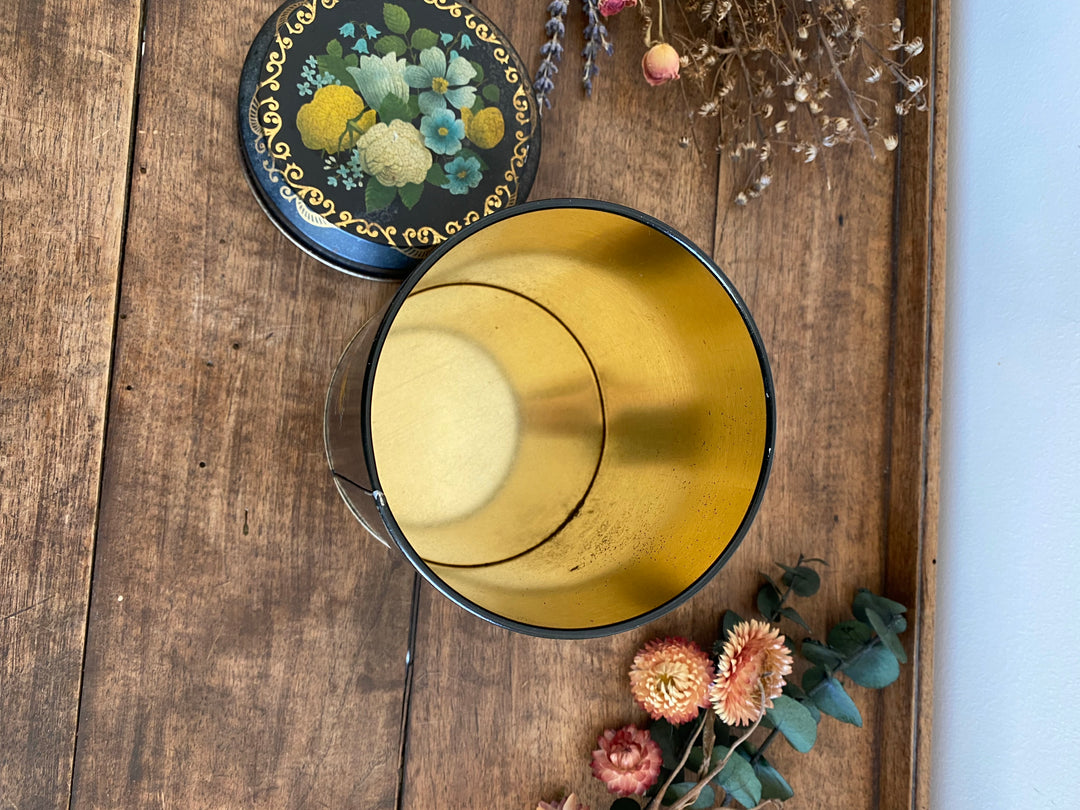Boîte en métal noir liseré doré avec motifs fleurs