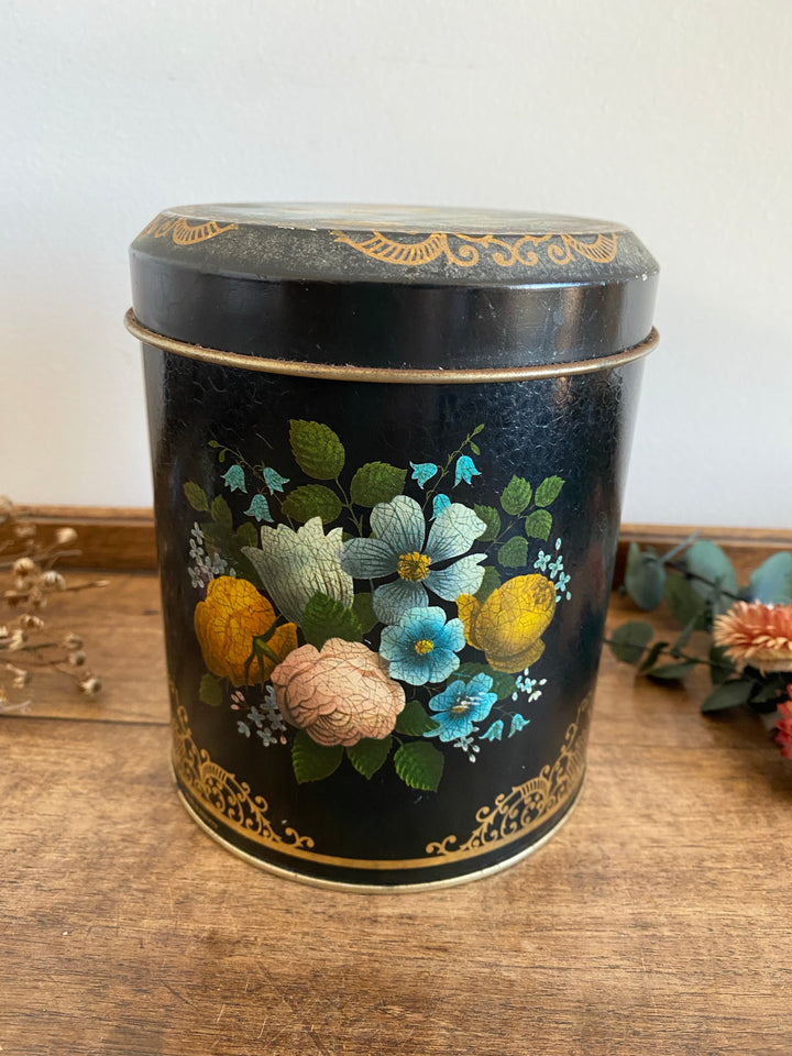 Boîte en métal noir liseré doré avec motifs fleurs