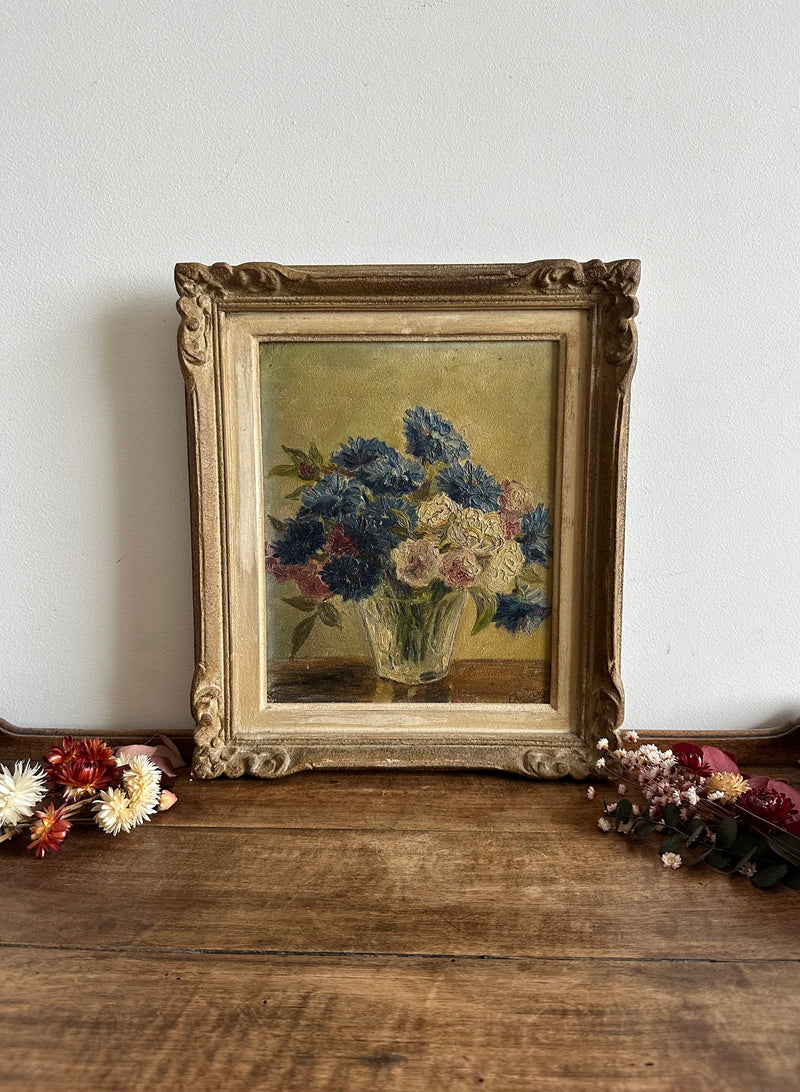 Peinture bouquet de fleurs bleues et blanches encadrée années 50