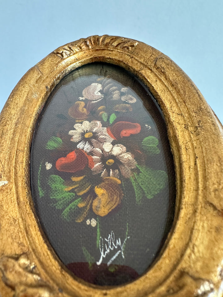 Peinture florale sous verre cadre ovale doré long et fin