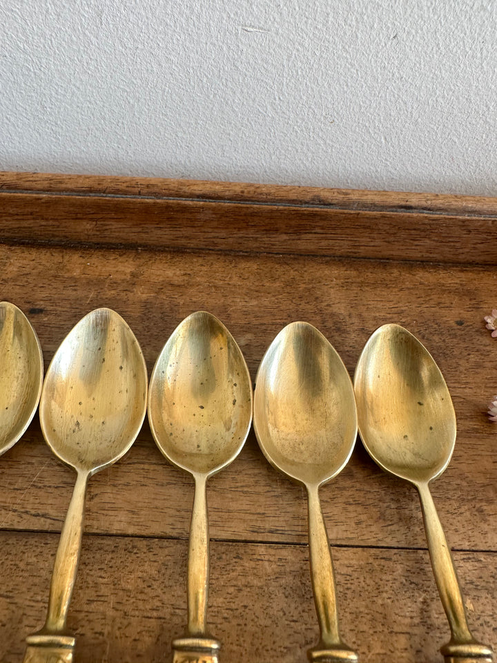 Couverts à dessert en bakélite jaune et laiton