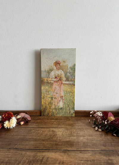 Impression jeune femme en robe rose dans les champs