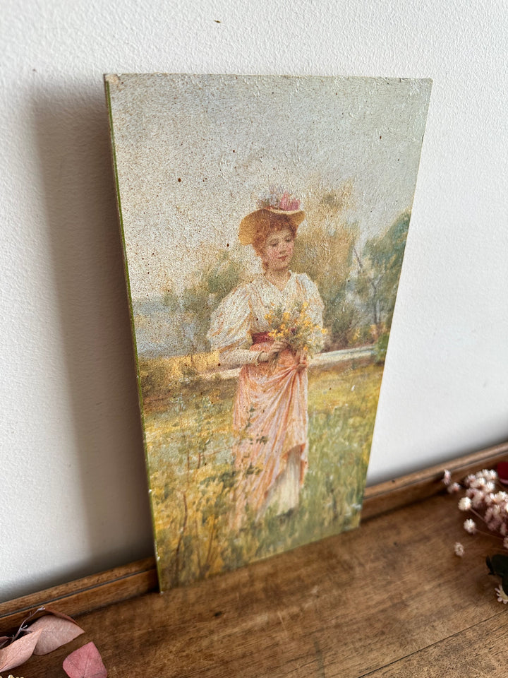 Impression jeune femme en robe rose dans les champs