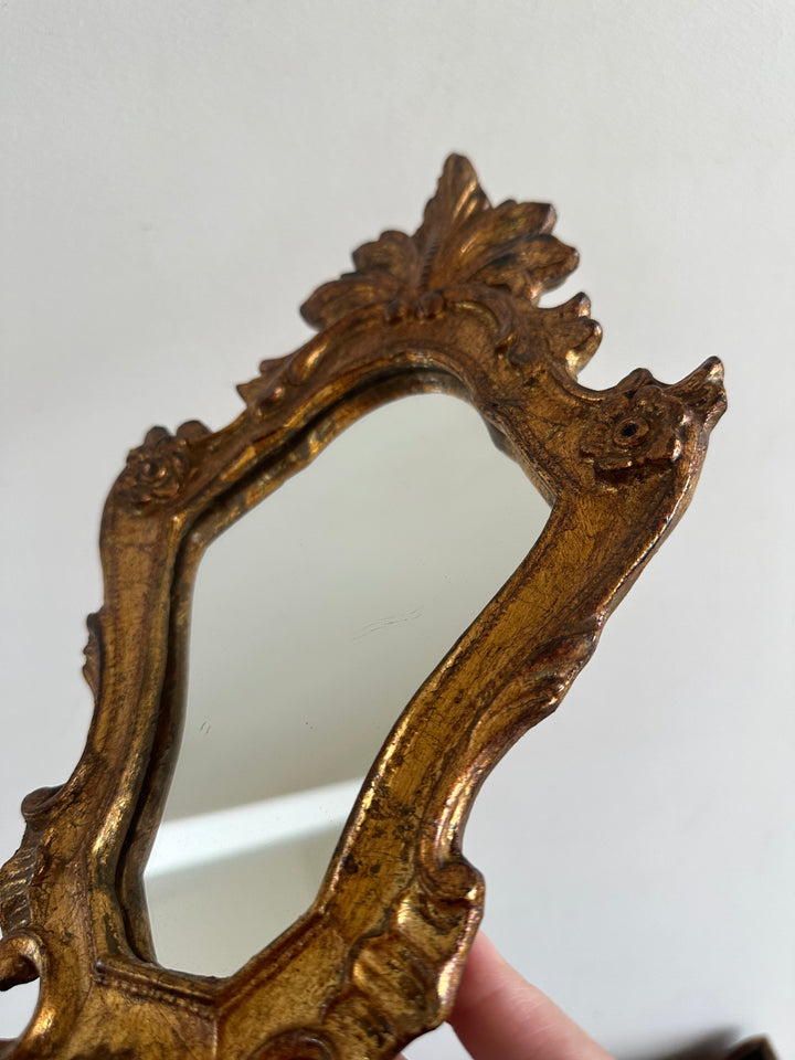 Miroir rocaille en bois doré