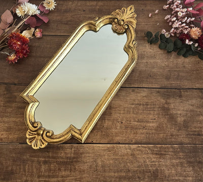 Miroir chantourné en bois doré