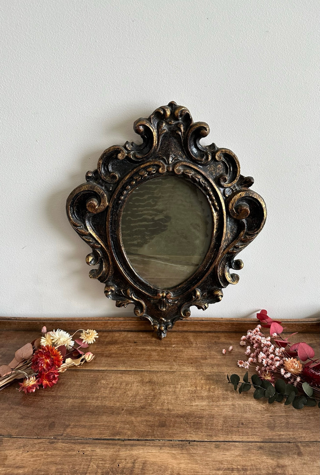 Miroir florentin en bois couleur noir et or