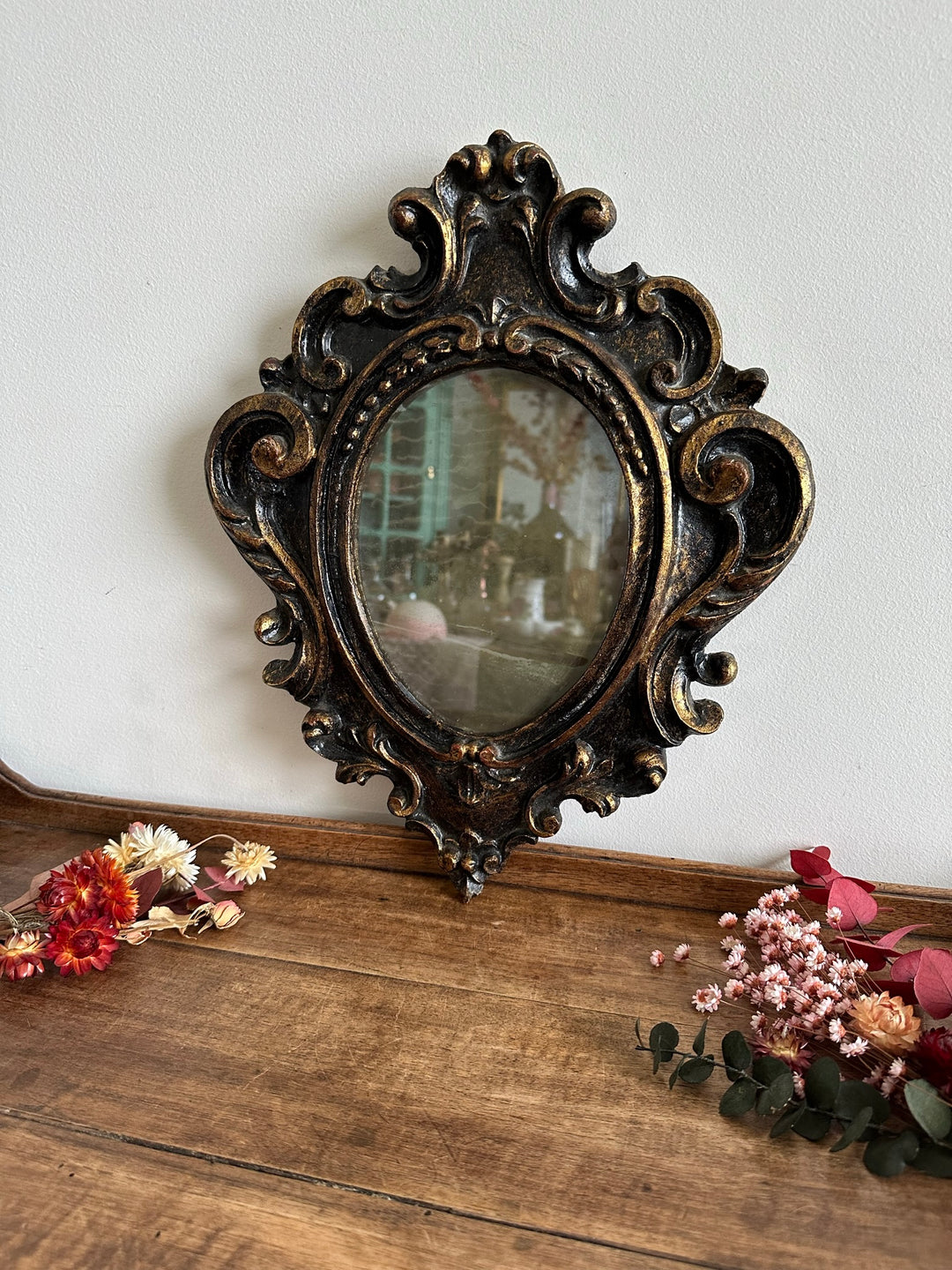 Miroir florentin en bois couleur noir et or