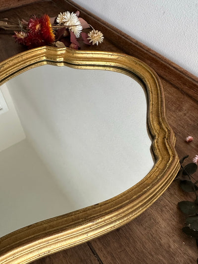 Miroir en bois doré chantourné