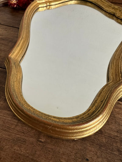 Miroir en bois doré chantourné